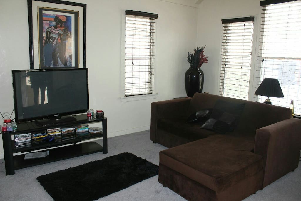 Living room w/ tv includes fire place for appreciate seasons