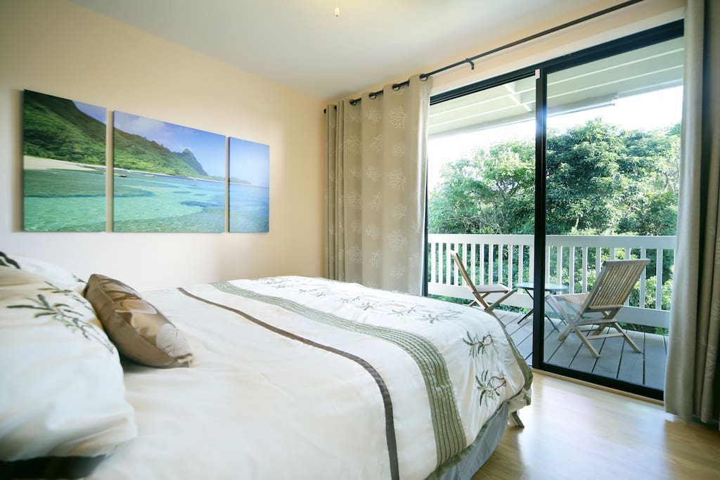 King Bed overlooking private patio with jungle and Hanalei Ridgeline views!