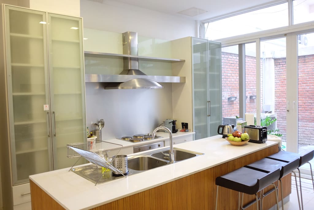 Kitchen is equipped with modern appliances.