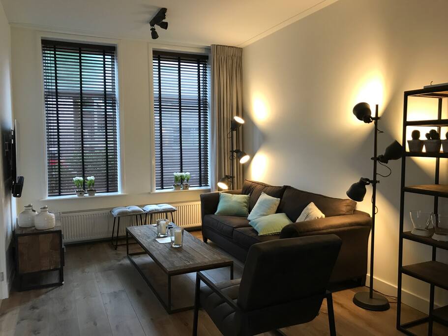 Stylish living area with large TV and Sonos sound system