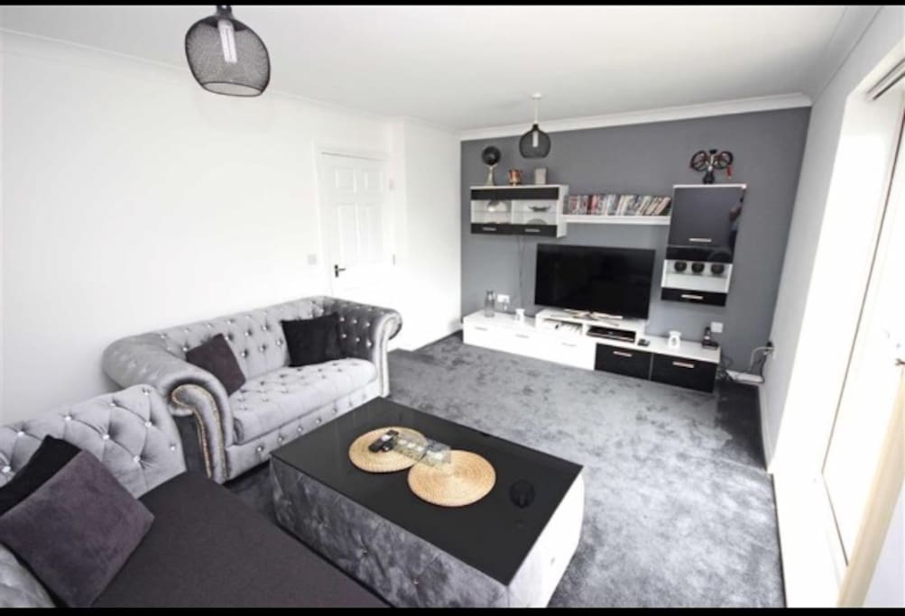 Highly furnished lounge with new Chesterfield Sofas.