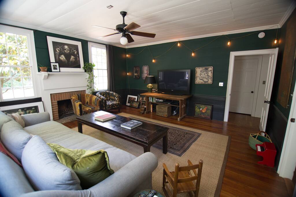 Sitting room features a flat-screen TV for viewing and large sofa that can sleep an extra person