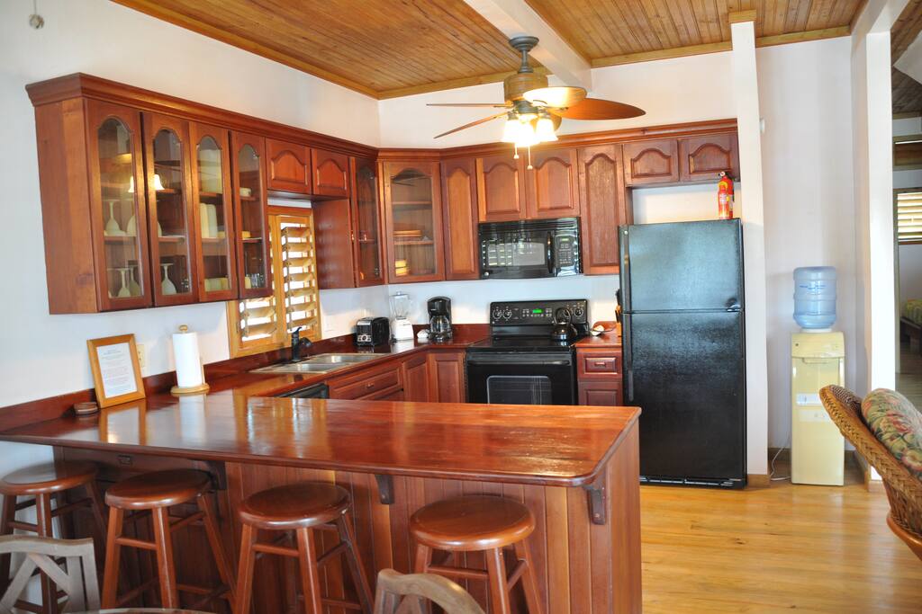 Kitchen with Custom Mahogany Cabinets and Counter Bar