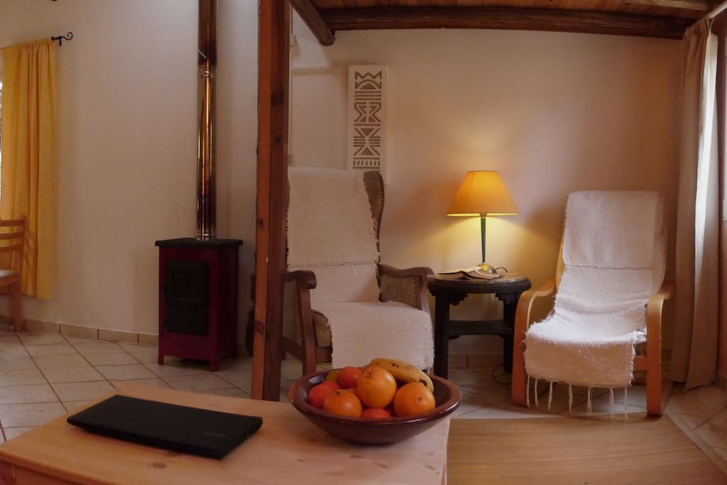In the living room under the high bed, you can forget the time in this reading corner. During the winter time a wooden stove can easily heats the entire house if needed.