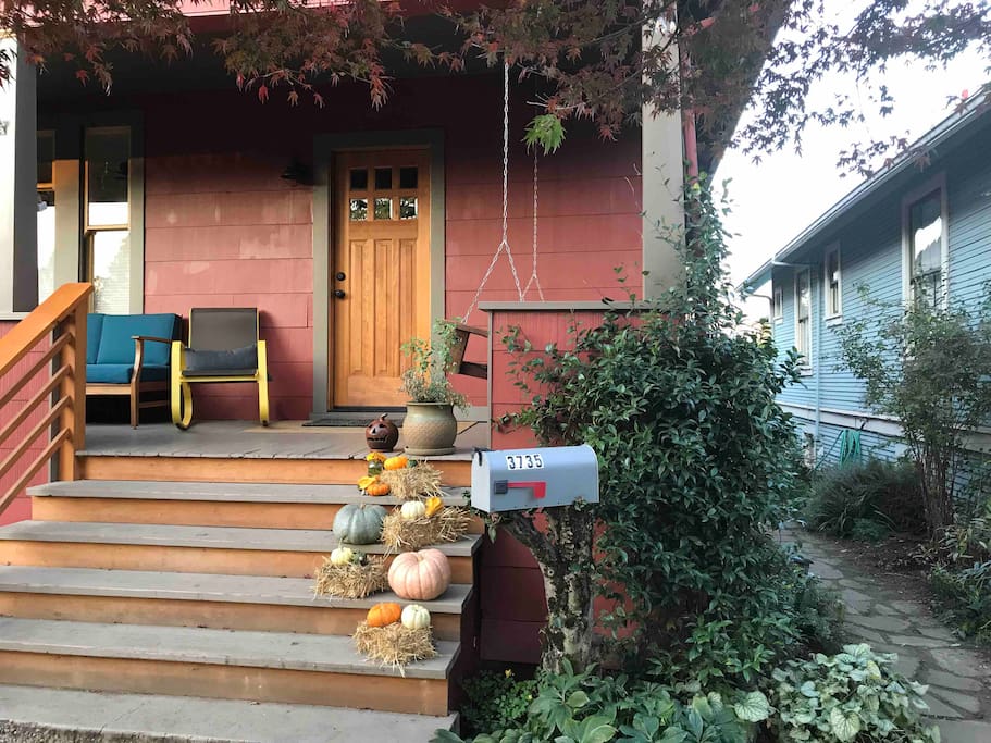 Front of the house with the access path to the right going to studio entrance in back.