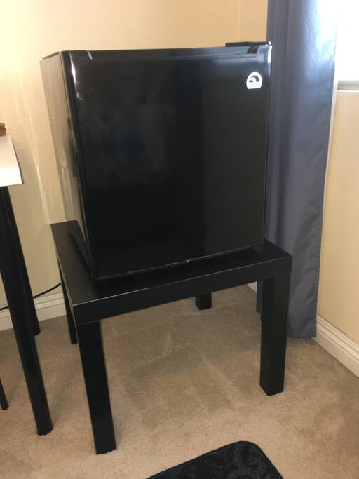 A mini fridge to keep your beverages and food nice and cold on a hot day