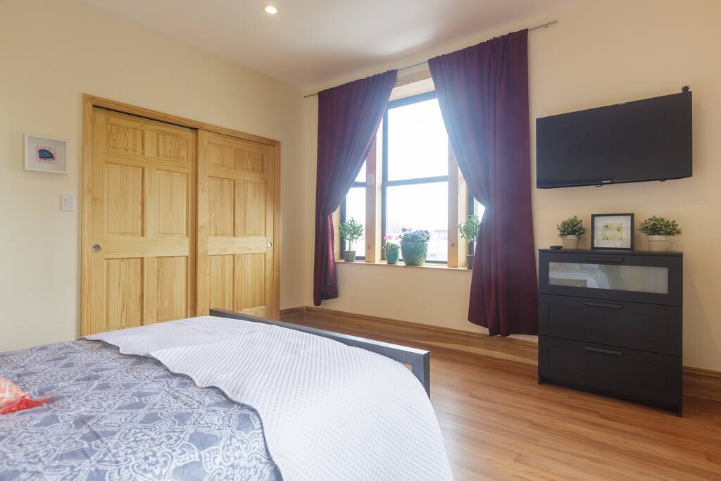 Other view of bedroom with large closet, Smart TV and dresser