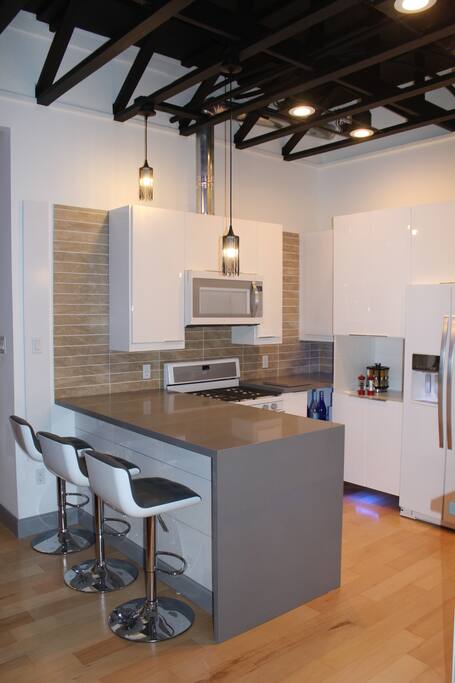 Full kitchen with bar seating.