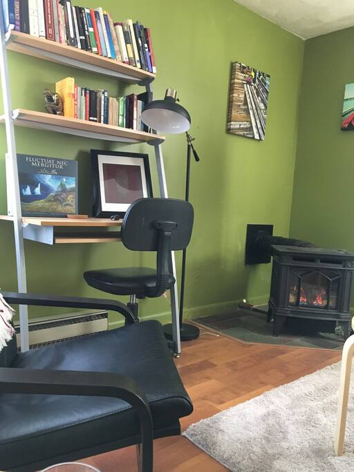 desk and cozy gas fireplace