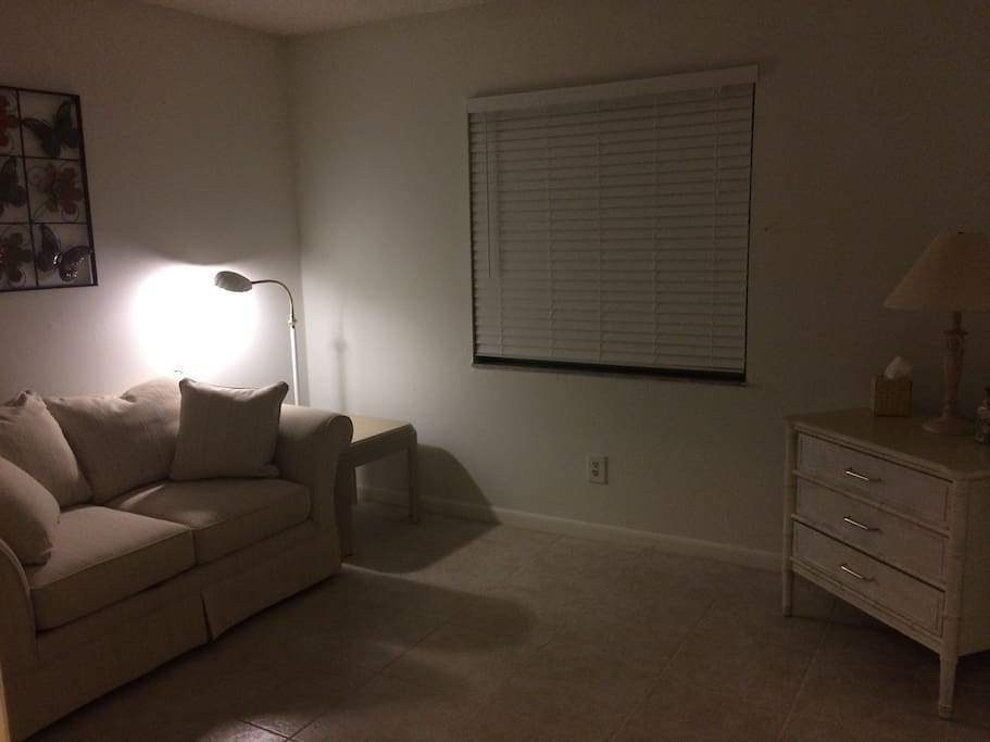 The second bedroom is a comfortable den/sitting room for reading and relaxing