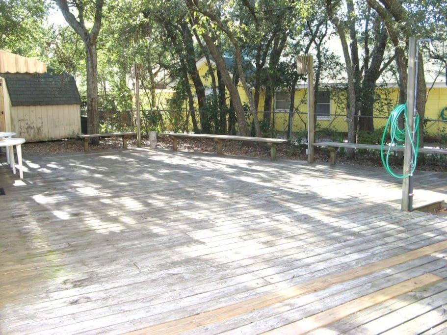 Enjoy the Tybee breezes and sounds of the ocean on the large decked backyard that features a beach shower