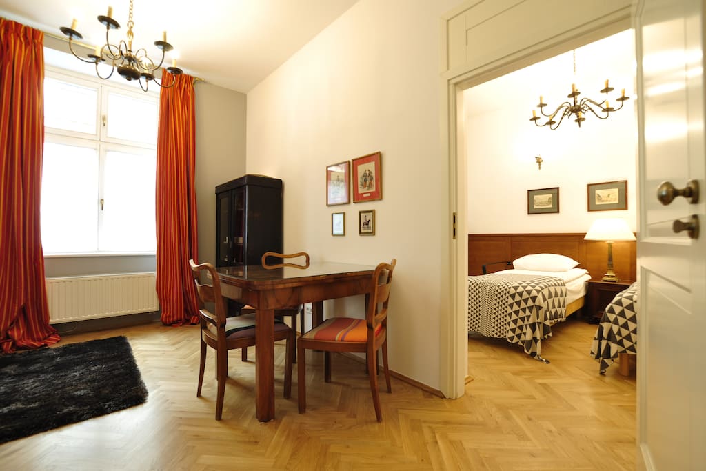 Bright kitchen/dining area with entrance to the bedroom