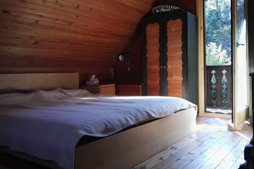 In the upper floor there is only a bedroom with double bed and single bed and a lovely little balcony with the most amazing view over Julian Alps.