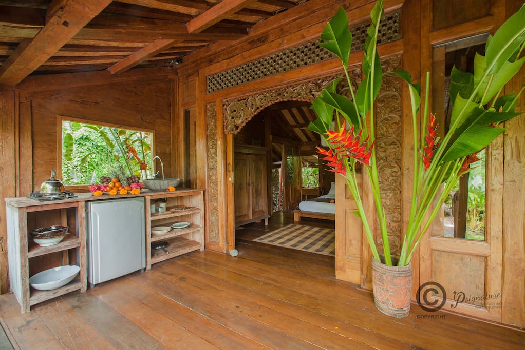 The master bedroom and small kitchen