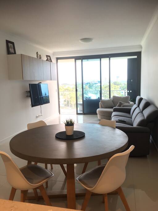 Dinning table/ living area.
Seating around table for 6 (two more matching chairs available) plus 3 stools from breakfast bar.