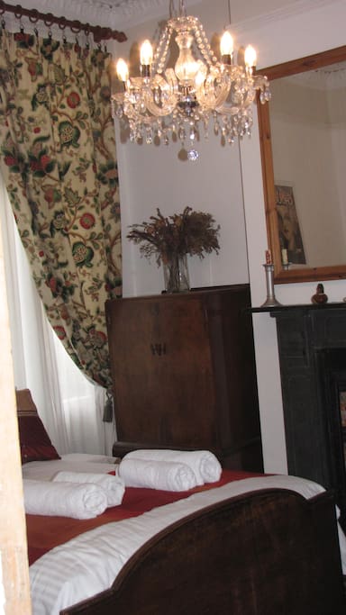 White bed linen and towels are provided.