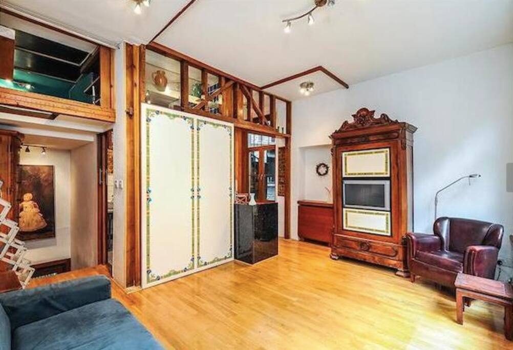 A view of the stairway up to the living room and to the loft bed.