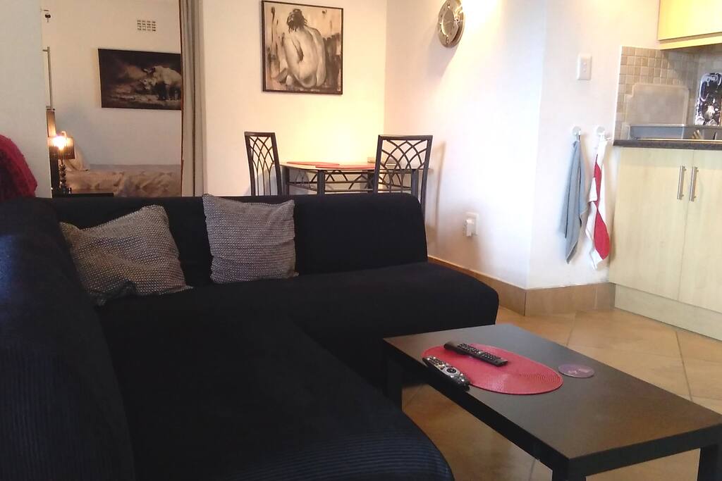 Lounge / Dining Area - has wall mounted LED TV including DSTV