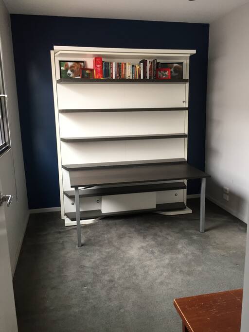 Bedroom with Bed stowed and Desk/Shelves