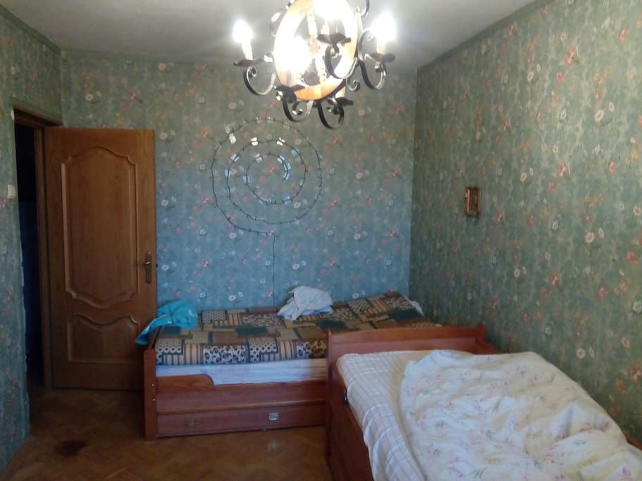 Two beds and a door with a lock. Две кровати и дверь с замком.