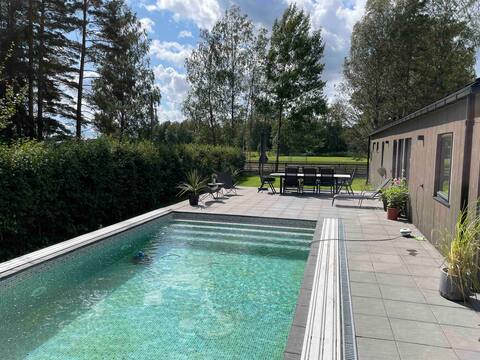 House with cozy garden and saltwater pool