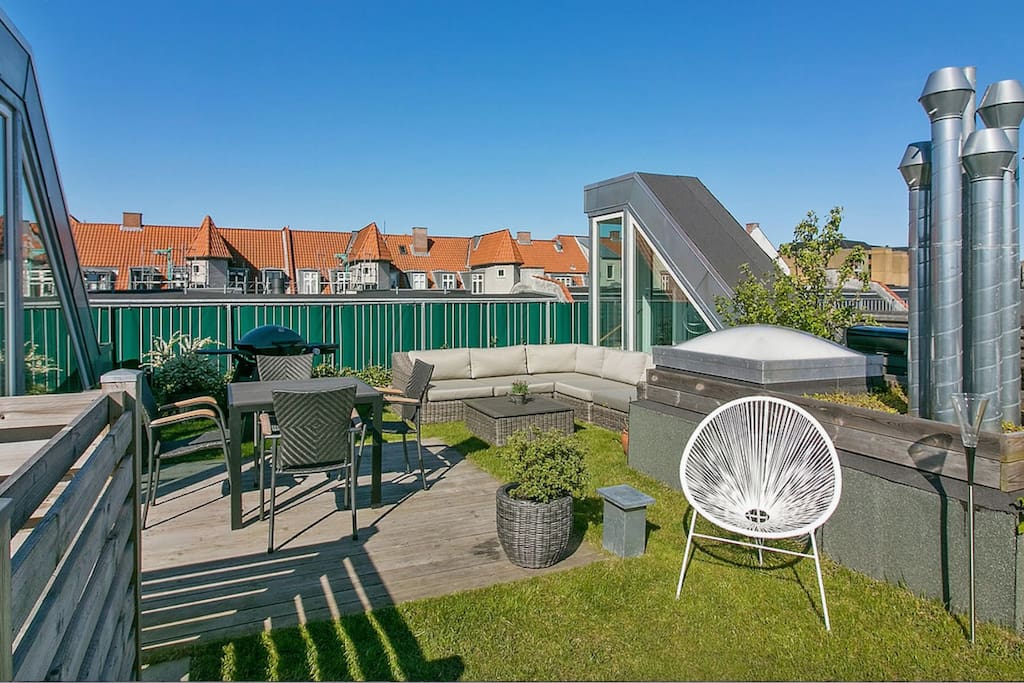 Enjoy a drink on the huge private rooftop terrace