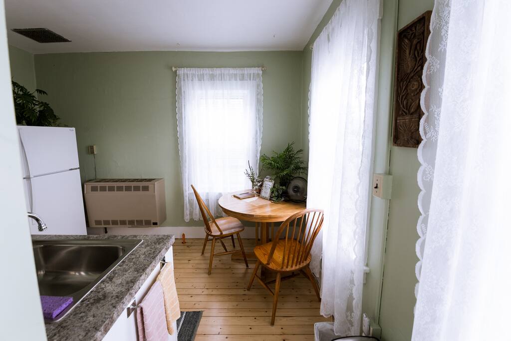 Kitchen table seats two or three (third chair can be found upstairs) and is the perfect place to enjoy a home cooked meal or set up a laptop.