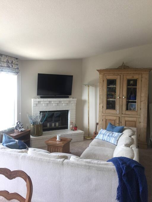 This is our cozy living room, great for game nights (games included in the brown cabinet!) as well as movie nights. TV has cable and a DVD player, as well as a sound bar which can play music from your iphone.