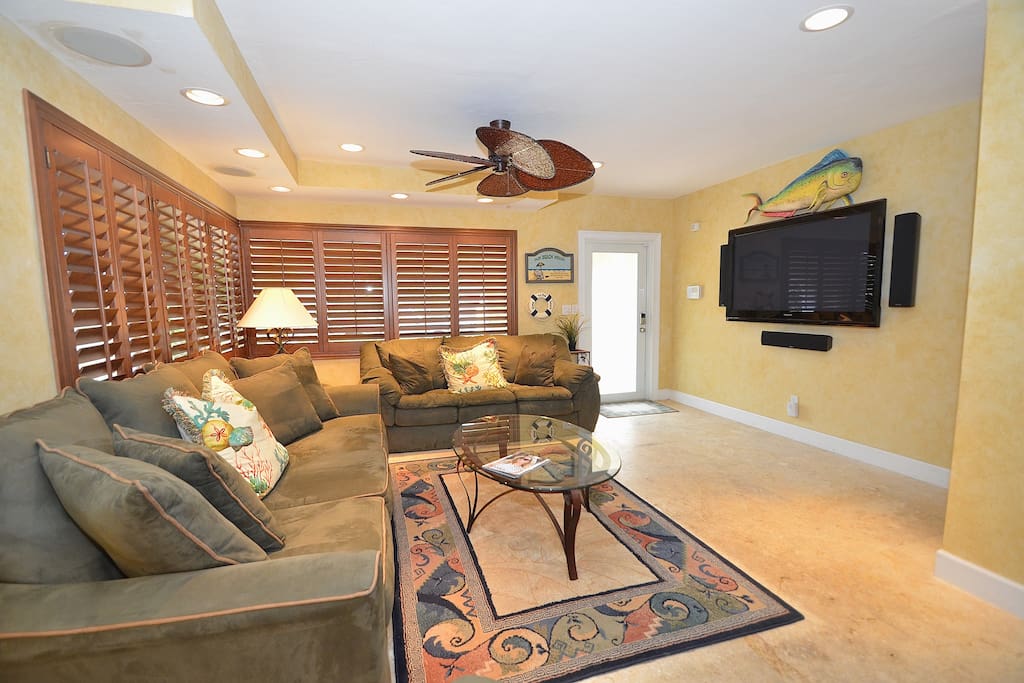 Spacious Open Living Area Offers Two (2) Full Size Sofas, Recliner Chair & 60 Inch LED High Def TV + Surround Sound System...