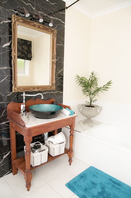 Bathroom has a bath & seperate shower