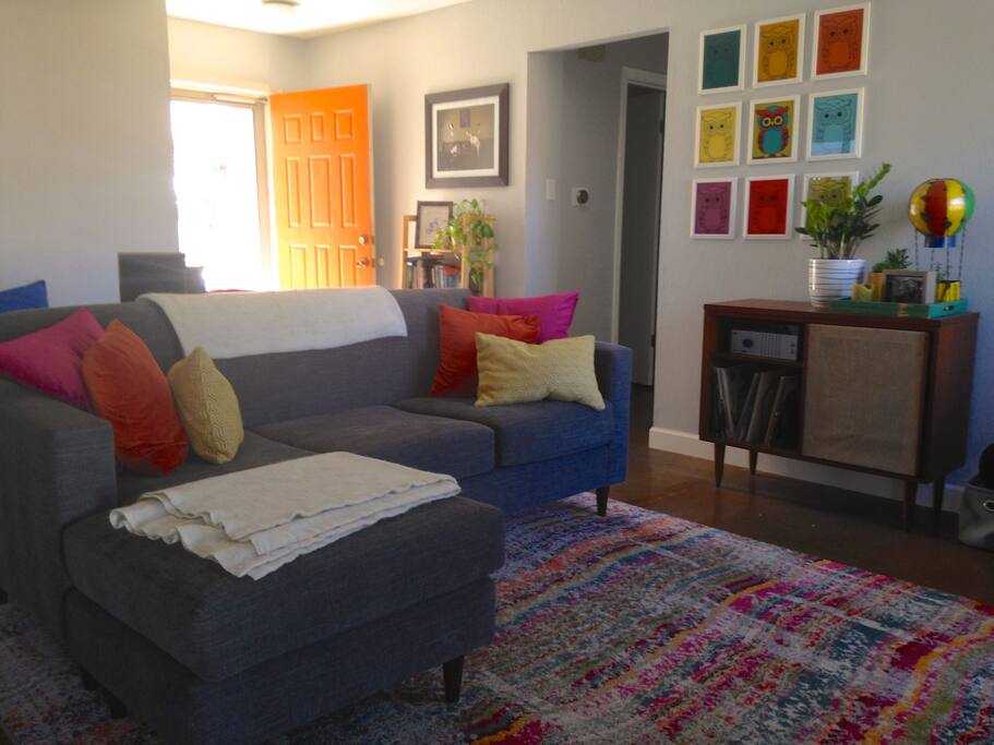 Main living space has AppleTV and record player.