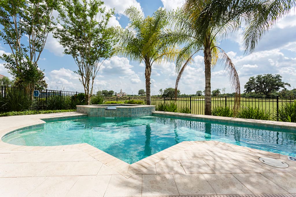 Take a dip in your private pool and spa overlooking the golf course