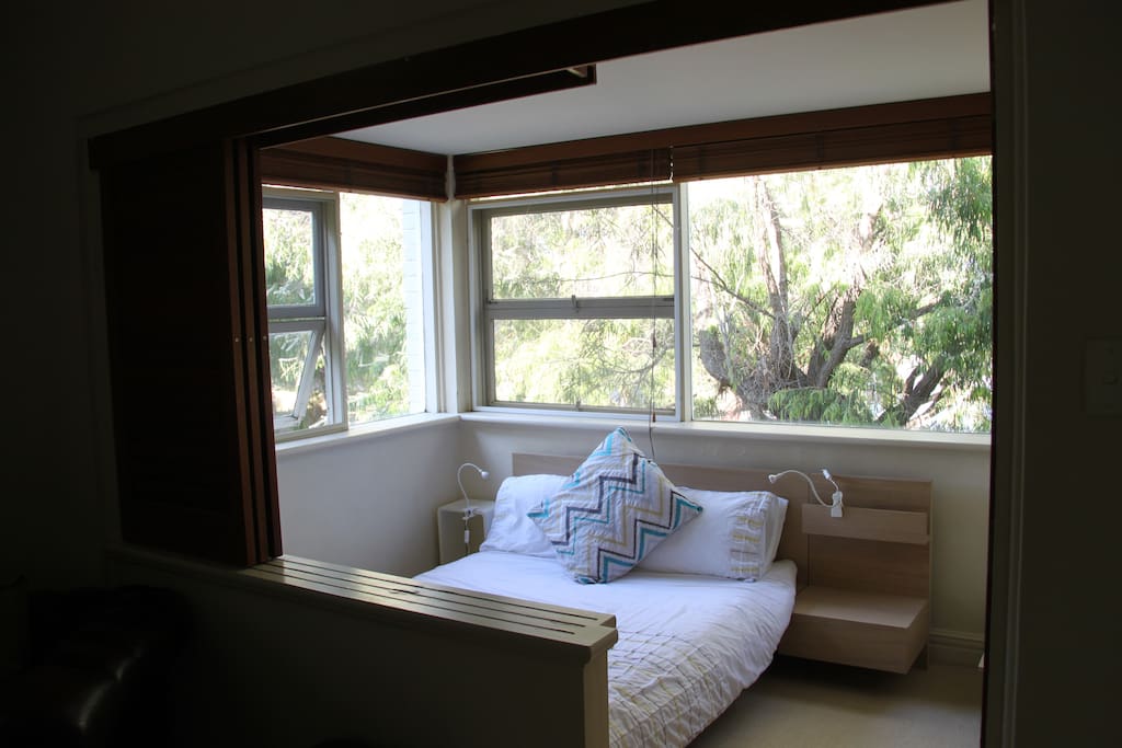 the 2nd bedroom has lots of light and a "tree-house" feel