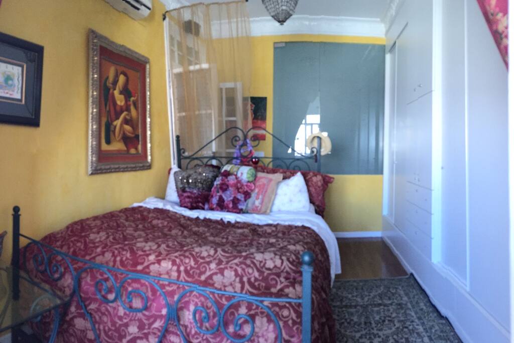Master bedroom with queen size bed and it's on enclosed bathroom.