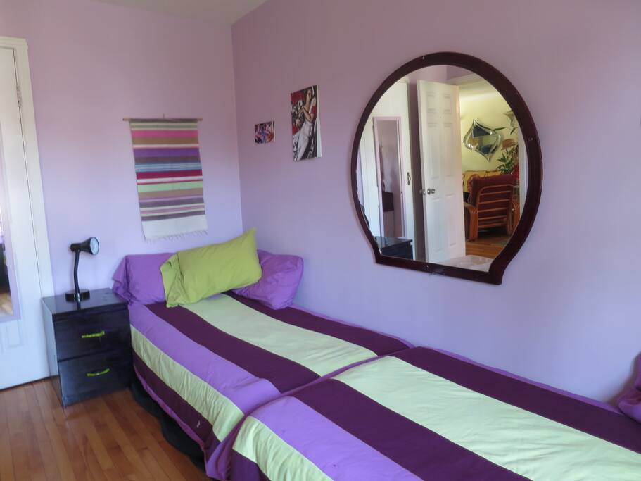 Twin bed #1:with night table drawers to place your belongings