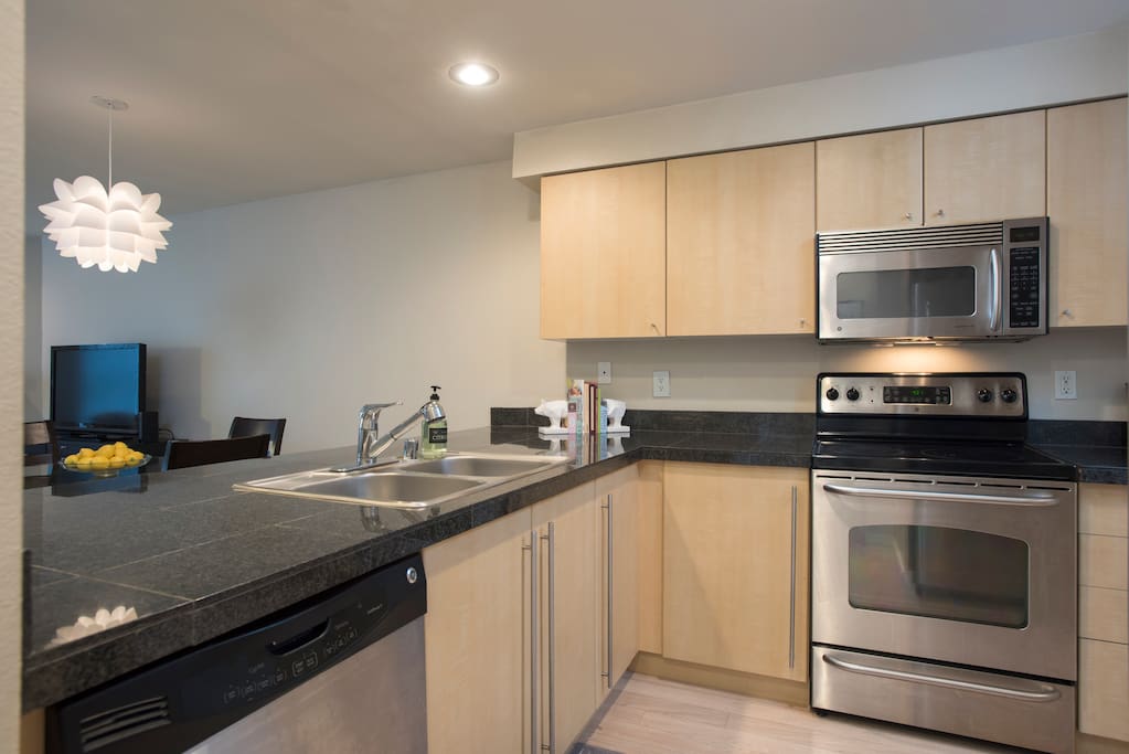 Fully stocked kitchen with stainless steal appliances.