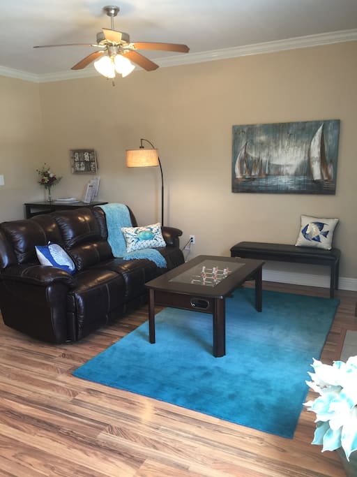 Stretch out & relax in the comfy living room! The coffee table doubles as a fun foosball game!