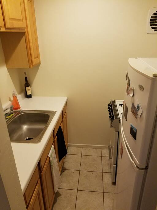 A small kitchen with full size amenities.