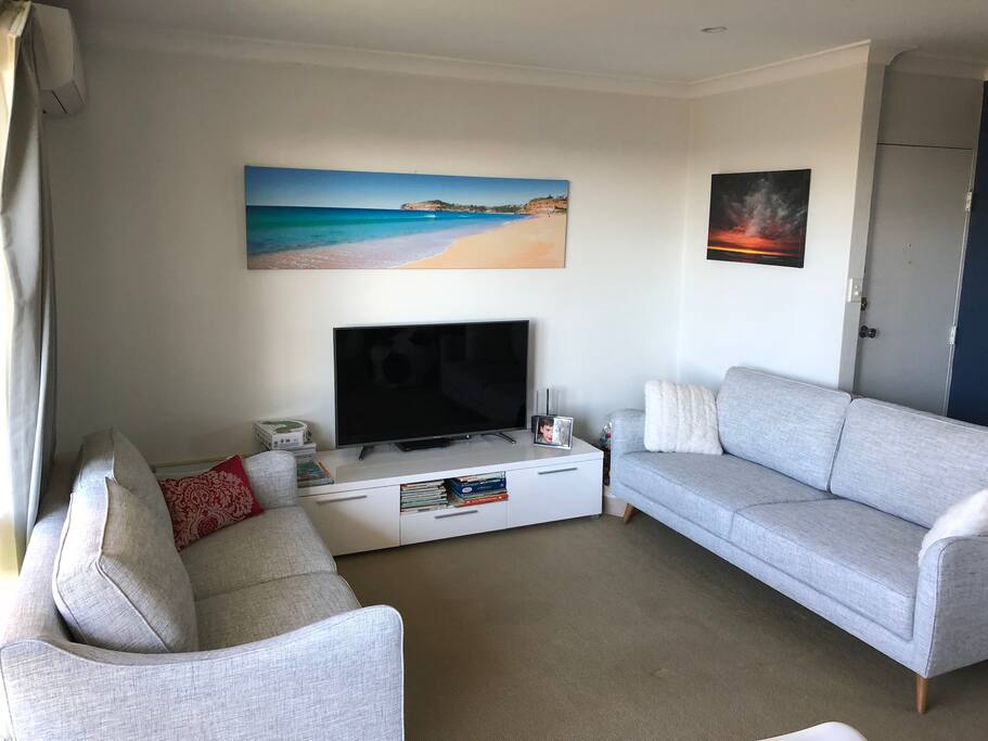 The lounge room is bright and has a brand new (June 2018) 3 seater and 2 seater lounge, new 55" Smart TV, with Netflix & Stan.