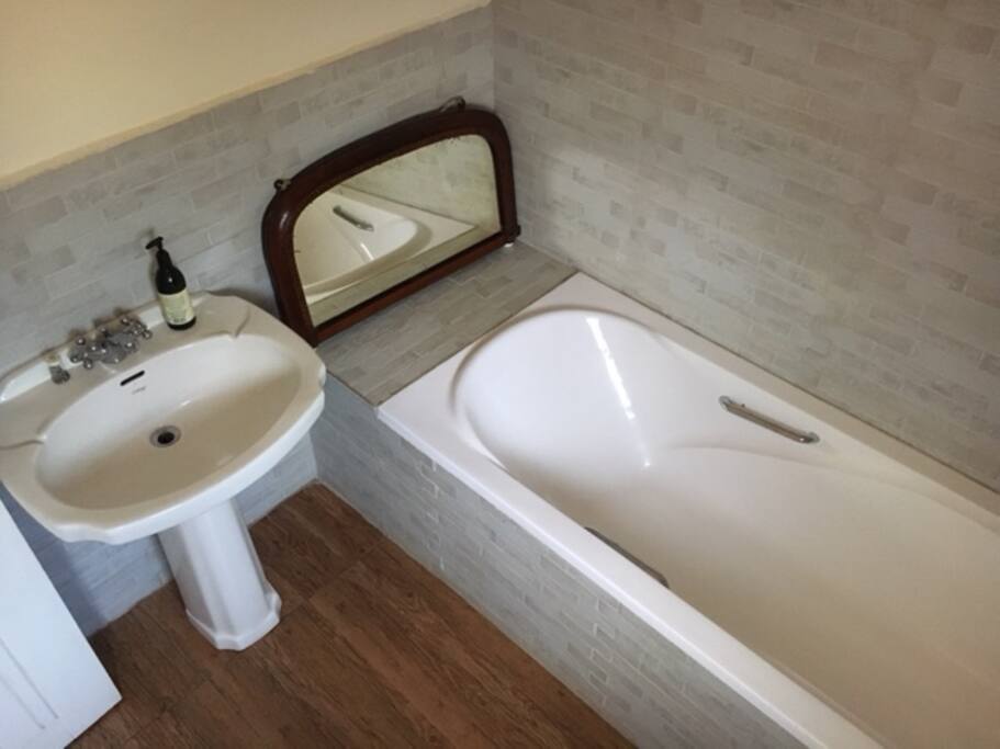 Bathroom with bath, shower, loo and sink