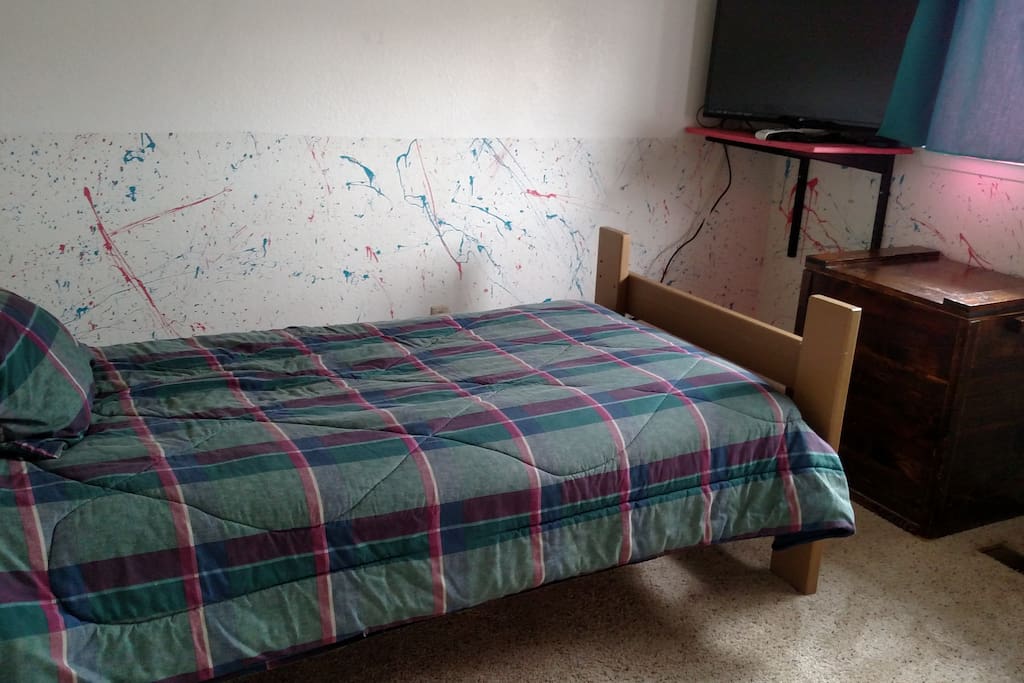 twin bed with a new mattress, accommodates 1