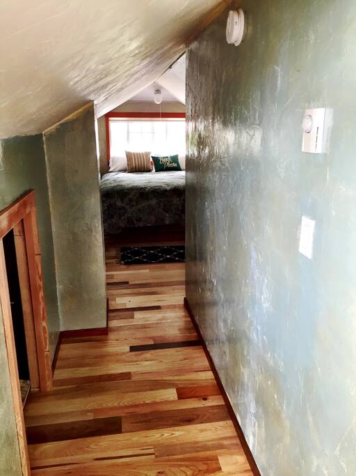 Hallway to bedroom, watch your head, because it does get a bit short up here.