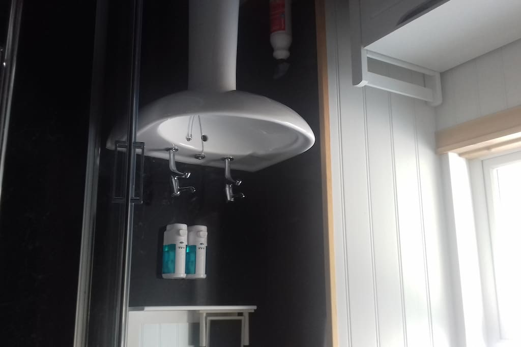 Shares bathroom with other twin room