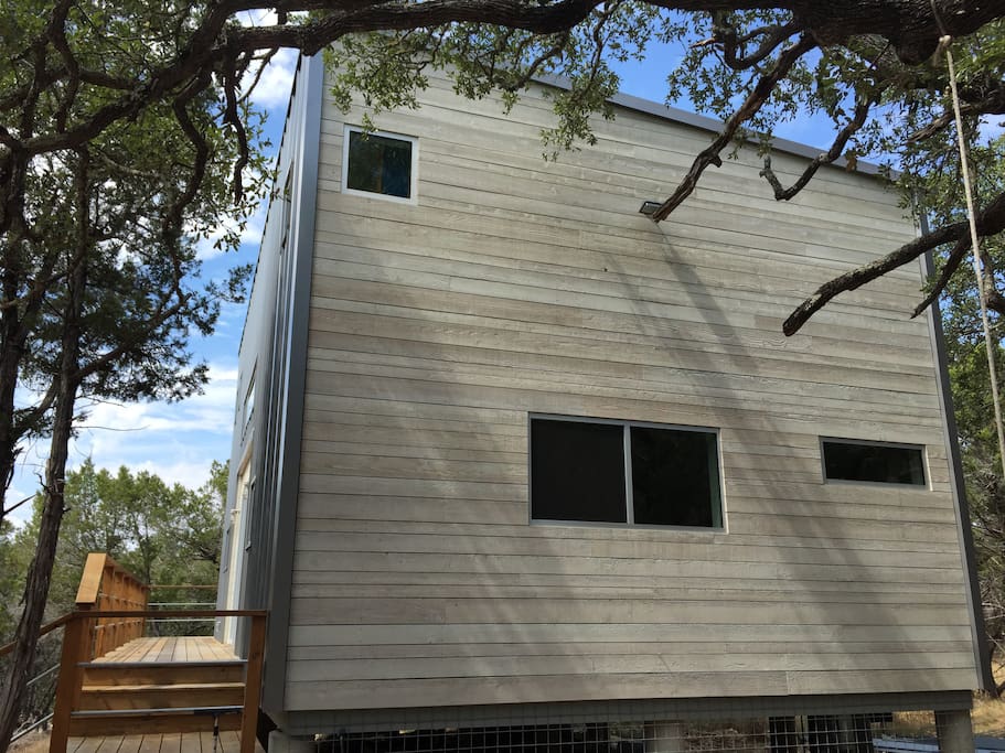 Windows bring in light to the lower guest bedroom and the shower..