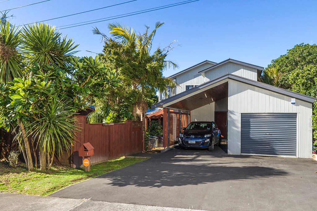 Front view of house, parking for up to 3 vehicles.