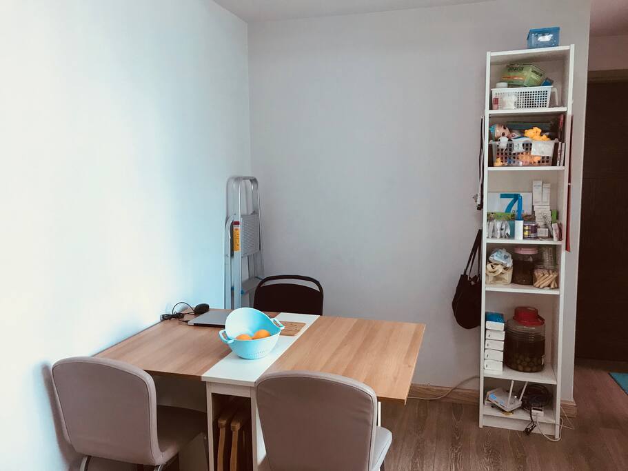 Dining table in the living room, feel free to eat and work here