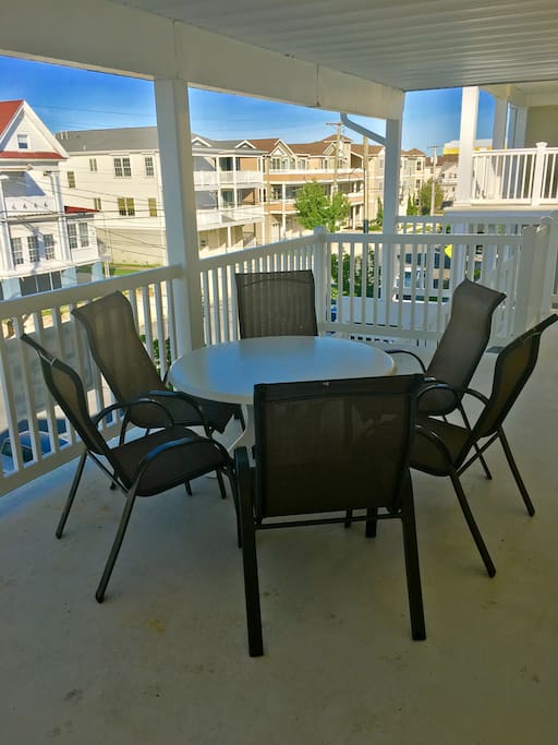 BALCONY VIEW WITH TABLE AND CHAIRS.