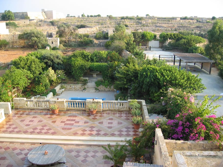 And looking down onto the upper terrace, garden, pool & paddock