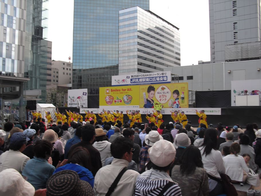 If you want to go straight to my HOUSE by bus from Sapporo station, there you must find its south exit (minami guchi; 南口). When you go out from it, you see several high buildings (photo), sometimes you can see an amusement such as YOSAKOI dance (photo).