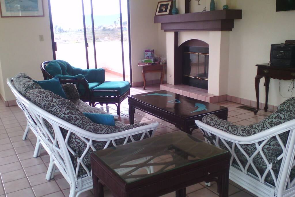 Living room with fireplace and NEW complete furniture set. Access to balcony.